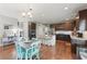 Spacious kitchen with stainless steel appliances, an island with seating, and dark wood cabinets at 110 Ashbury Circle Cir, Dallas, GA 30157