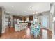 Bright kitchen with stainless steel appliances, an island with seating, and hardwood floors at 110 Ashbury Circle Cir, Dallas, GA 30157