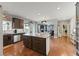 Spacious kitchen featuring an island, stainless steel appliances, and an open layout to the Gathering room at 110 Ashbury Circle Cir, Dallas, GA 30157