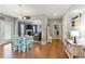 Open concept living room with hardwood floors, eat-in area and fireplace at 110 Ashbury Circle Cir, Dallas, GA 30157