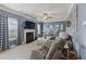Comfortable living room featuring a fireplace, ceiling fan, and stylish decor at 110 Ashbury Circle Cir, Dallas, GA 30157