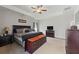 Main bedroom featuring a large bed, trey ceilings, neutral paint, large windows and carpeted floors at 110 Ashbury Circle Cir, Dallas, GA 30157