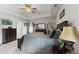 Main bedroom features a neutral color palette, large bed, lots of furniture, and carpeted floors at 110 Ashbury Circle Cir, Dallas, GA 30157