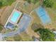 Bird's eye view of community pool, playground, tennis court, parking, and recreation center at 11833 Spring Lake Way, Fayetteville, GA 30215