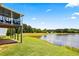 Backyard offers serene lake views, perfect for relaxation and enjoying nature's beauty at 11833 Spring Lake Way, Fayetteville, GA 30215