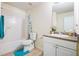 Standard bathroom featuring a shower/tub combo and granite top vanity sink at 11833 Spring Lake Way, Fayetteville, GA 30215
