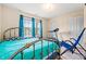 Bedroom with metal frame bed, exercise equipment and window view at 11833 Spring Lake Way, Fayetteville, GA 30215