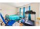 Bedroom with metal frame bed, exercise equipment, and window view at 11833 Spring Lake Way, Fayetteville, GA 30215
