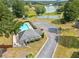 Aerial view of the community pool, tennis courts, playground, and parking near the lake at 11833 Spring Lake Way, Fayetteville, GA 30215