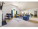 Spacious living room with vaulted ceiling, neutral carpet, and bright furniture at 11833 Spring Lake Way, Fayetteville, GA 30215