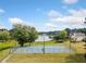 Community tennis courts offering a fun activity with scenic lake view at 11833 Spring Lake Way, Fayetteville, GA 30215