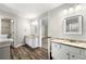 Bright bathroom featuring double sinks and vanity at 2479 Heatherton Ct, Dacula, GA 30019
