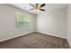 Bedroom with a ceiling fan and natural light from one window at 2479 Heatherton Ct, Dacula, GA 30019