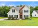 Charming two-story home with a landscaped yard and brick accents at 2479 Heatherton Ct, Dacula, GA 30019