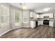 Eat-in kitchen with white cabinets and stainless steel appliances at 2479 Heatherton Ct, Dacula, GA 30019