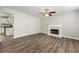 Bright living room featuring a fireplace and hardwood flooring at 2479 Heatherton Ct, Dacula, GA 30019