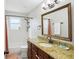 Bright bathroom with granite countertops, a large mirror, and a shower/tub combo at 456 Pretty View Se Ln, Smyrna, GA 30082
