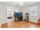 Spacious office with wood floors, computer setup, and bright, natural light at 456 Pretty View Se Ln, Smyrna, GA 30082