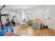Versatile room with toys, workout equipment, and laminate wood floors at 456 Pretty View Se Ln, Smyrna, GA 30082