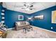 Comfortable basement featuring a sofa, glass coffee table, and soft lighting at 6490 Ivey Hill Dr, Cumming, GA 30040