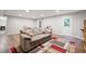 Basement including a comfortable sofa, carpet, walkout door, and recessed lighting at 6490 Ivey Hill Dr, Cumming, GA 30040