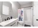 Bright bathroom featuring a vanity with drawers and a shower-tub combination at 6490 Ivey Hill Dr, Cumming, GA 30040