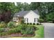 Charming home with well-manicured front yard and lush landscaping at 6490 Ivey Hill Dr, Cumming, GA 30040