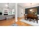 Open-concept living space showcasing hardwood floors, a fireplace, and seamless flow to the dining area, perfect for entertaining at 6490 Ivey Hill Dr, Cumming, GA 30040
