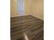 Bedroom with new flooring, natural light, base molding, and neutral walls at 6851 Roswell Rd # 15, Atlanta, GA 30328