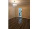 Dining area leading to the kitchen features new flooring, chair rail, and ample natural light at 6851 Roswell Rd # 15, Atlanta, GA 30328