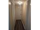 Hallway featuring flooring, white door, and closet with doors at 6851 Roswell Rd # 15, Atlanta, GA 30328