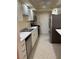 Galley kitchen featuring stainless steel appliances and white marble countertops at 6851 Roswell Rd # 15, Atlanta, GA 30328