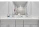 Modern bathroom featuring double sinks, sleek countertops, and a glass-enclosed shower for a spa-like experience at 1542 Villageside Ct, Lawrenceville, GA 30043