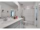 Bright bathroom featuring a long vanity with a sink and a bath tub at 1542 Villageside Ct, Lawrenceville, GA 30043