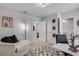 Bright, carpeted bedroom features stylish decor, a patterned rug, and neutral paint at 1542 Villageside Ct, Lawrenceville, GA 30043