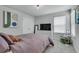 Comfortable bedroom with natural light, a closet, carpeted floor, and ceiling light at 1542 Villageside Ct, Lawrenceville, GA 30043