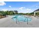 Enjoyable community pool area with ample lounge chairs and clear blue water under a sunny sky at 1542 Villageside Ct, Lawrenceville, GA 30043