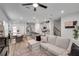 Inviting open-concept living room with a view of the modern kitchen and dining area at 1542 Villageside Ct, Lawrenceville, GA 30043