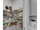 Well-organized pantry with ample shelving stocked with a variety of food items at 1542 Villageside Ct, Lawrenceville, GA 30043
