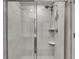 Contemporary shower featuring sleek tile work, a modern showerhead, and built-in shelving for added convenience at 1542 Villageside Ct, Lawrenceville, GA 30043