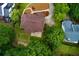 This aerial shot highlights the home's backyard, patio, and lush landscaping at 5741 Stonekirk Walk Northwest, Acworth, GA 30101