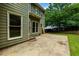 View of the home's rear exterior with a patio and grassy backyard at 5741 Stonekirk Walk Northwest, Acworth, GA 30101