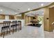 Finished basement featuring a bar area with seating, a billiard table, and tile floors at 5741 Stonekirk Walk Northwest, Acworth, GA 30101