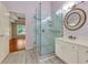 Modern bathroom with a glass enclosed shower, marble surround, and double sink vanity at 5741 Stonekirk Walk Northwest, Acworth, GA 30101