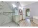 Bathroom with marble shower, vanity, and soaking tub at 5741 Stonekirk Walk Northwest, Acworth, GA 30101