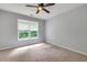 Bright bedroom with neutral carpet and a large window providing natural light at 5741 Stonekirk Walk Northwest, Acworth, GA 30101