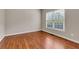 Cozy bedroom with hardwood floors and a window, offering natural light and a comfortable space at 5741 Stonekirk Walk Northwest, Acworth, GA 30101