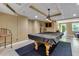 This billiard room features decorative ceilings, a modern light fixture and access to the outdoors at 5741 Stonekirk Walk Northwest, Acworth, GA 30101