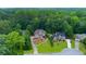 Charming two-story home with manicured lawn, mature trees, and traditional architecture in a desirable neighborhood at 5741 Stonekirk Walk Northwest, Acworth, GA 30101