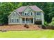Charming two-story home with a covered front porch and meticulous landscaping for curb appeal at 5741 Stonekirk Walk Northwest, Acworth, GA 30101